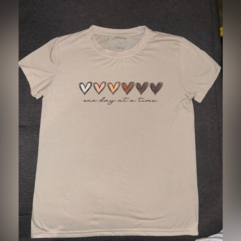 A tan colored T-shirt size medium from Shein